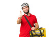 © luismolinero - Young delivery man with thermal backpack over isolated chroma key background showing and lifting a finger