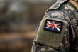 © antusher - Australian soldier's uniform with flag patch, camouflage fabric, solemn atmosphere, macro photography