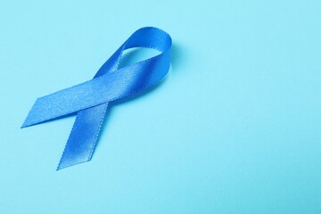 Canvas Print - Blue ribbon on color background, space for text. Prostate cancer awareness