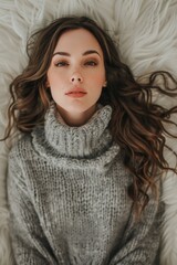 Poster - Young woman modeling winter casual fashion in a cozy studio setting