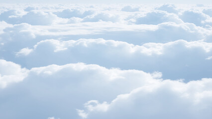 Wall Mural - White Clouds from above. Aerial view of the fluffy white cloud on blue sky. Top view from an airplane over white clouds in a blue sky. High in the Heavens.