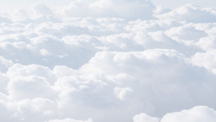Wall Mural - White Clouds from above. Aerial view of the fluffy white cloud on blue sky. Top view from an airplane over white clouds in a blue sky. High in the Heavens.