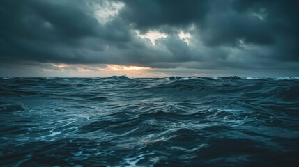 Ocean at dusk under cloudy sky