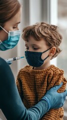 Wall Mural -  Child receiving a vaccination. Little boy in face mask in doctor's office is vaccinated. Kid giving injection shot.  coronavirus, flu vaccine. Dangerous infectious disease,