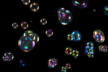 Sticker - Soap bubbles isolated on a black background