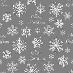 Wall Mural - simple seamless Christmas pattern of white snowflakes on a gray background, texture