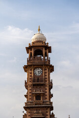 jodhpur, india - march 23, 2024: the famous clock tower and people at sardar market in the historic 