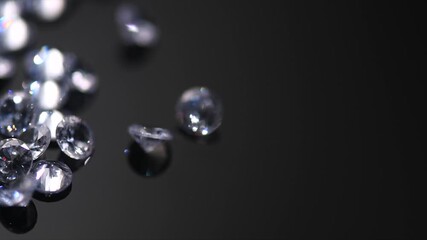 Poster - Diamonds rotating over black background, crystals, beautiful luxury brilliants sparkling with colorful caustics, rainbow lights. Moissanite. Zirconia. Slow motion