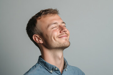 Wall Mural - A close up of a man's face with her eyes closed