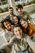 © Iuliia - Young People Taking Selfie Together in First Person View, Fun Group Photo