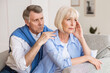 © Prostock-studio - Mature husband and wife arguing, man trying to resolve family conflict at home