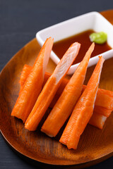 Canvas Print - Crab sticks on wooden plate eating with wasabi and sauce