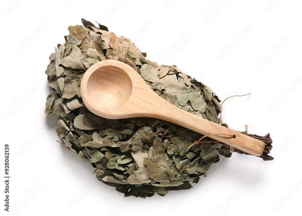 Oak broom for sauna and wooden ladle on white background