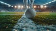 © Thaniya - Close-up soccer ball on the line with a player's leg in a brightly lit stadium, moment before the kick, with the vibrant stadium lights and well-maintained field setting dramatic scene.