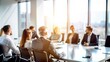 © Mari - Blurred Team Meeting Room - Soft-focus image of a team meeting room with people and furnishings.