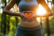 © Raool - Woman hand's with heart over stomach concept for exercise, diet, fitness, gut health and self love for wellness and training in the summer for healthy, Generative AI