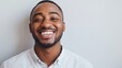 © Maria - handsome confident cheerful black man smiling on white background