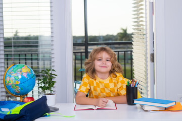 Fototapete - Child reading book. Nerd school kid doing homework at home. Clever child from elementary school with book. Smart genius intelligence kid ready to learn. Hard study.