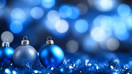 Wall Mural - Blue Christmas ornaments with a sparkling silver and blue bokeh background, creating a cool and festive holiday atmosphere.