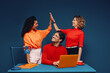 © Jacob Lund - Group of colleagues celebrating success in the office