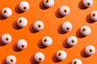 © Westend61 - Halloween candy with eyeball wrapping against orange background