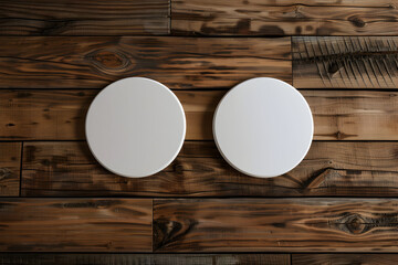 Two blank white circles on a rustic wooden background.