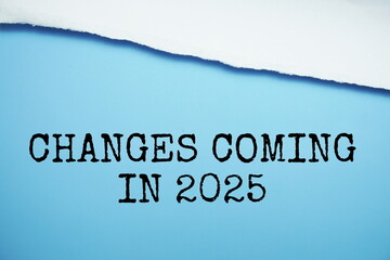 Changes Coming in 2025 text on blue background with white paper torn, New year resolutions and planning concept