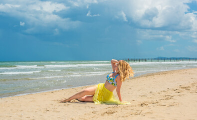 Wall Mural - Vacation at sea, woman at Italy beach. Lady in bright swimwear