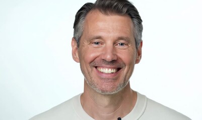 Canvas Print - Portrait of a smiling middle-aged man on a white background