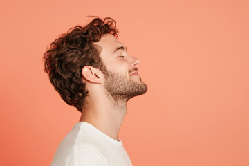 A close up of a man's face with his eyes closed