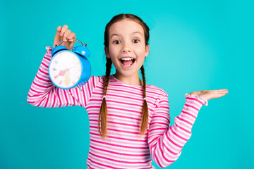 Canvas Print - Photo of excited glad cheerful adorable cheerful girl wear stylish pink clothes isolated on cyan color background