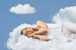 © Ljupco Smokovski - Young woman in pajamas sleeping on clouds