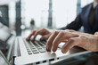 © Katsiaryna - Closeup image of a man working and typing on laptop computer keyboard