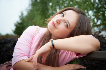 Portrait of young pretty woman with long brown hair