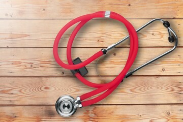 Poster - New medical stethoscope on desk background