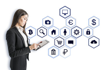 Aufkleber - Businesswoman using a tablet, surrounded by white holographic business icons on a white background, representing digital space concept
