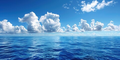 Breathtaking ocean view with clear blue water and fluffy clouds under a bright sky, perfect for travel or nature themes.