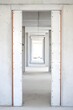 © duyina1990 - Empty Concrete Corridor with White Walls and Orange Trim