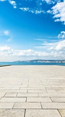 Sticker - Empty Stone Pavement With Sea and City Skyline in Distance