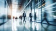 © CStock - Blurry  of professionals in a polished, high-tech office space,