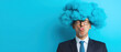 © Wonderful Studio - Man in suit with blue cloud hair making funny face, standing against a blue background, representing creativity and humor.