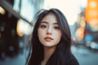 © Tidarat - a woman walking in city street at background