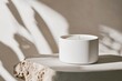 © id512 - white candle on stone surface with natural shadows, modern home decor and product branding concept