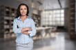 © BillionPhotos.com - Smiling business woman entrepreneur standing in office