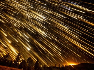 Wall Mural - Dynamic falling gold glitter stars with a long exposure, capture bright streaks of golden light against a starry night sky creates a mesmerizing effect of movement and energy.