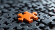 © AminaDesign - A standout and vibrant orange puzzle piece is resting amongst dark jigsaw pieces, symbolizing uniqueness in design