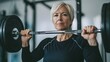 © pkproject - Empowered Senior Woman Lifting Weights,Challenging Age Stereotypes