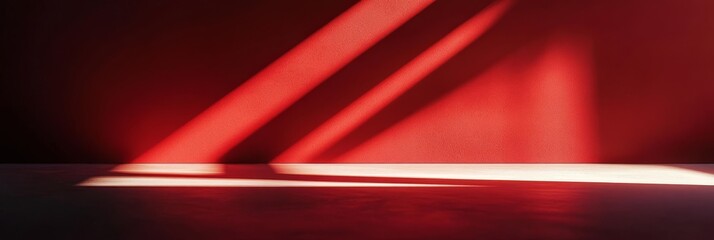 Poster - The play of light and shadow dances across a vibrant red backdrop, creating a unique and artistic ambiance