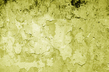 Peeling paint on grungy plaster wall. Yellow style.