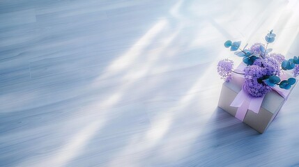 Wall Mural -  A gift box with a purple ribbon and a bouquet of flowers on top of it, set against a light blue background